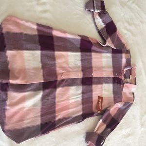 A pink and purple plaid dress with a gold belt